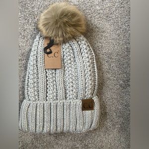 Brand new CC beanie with pom Pom.